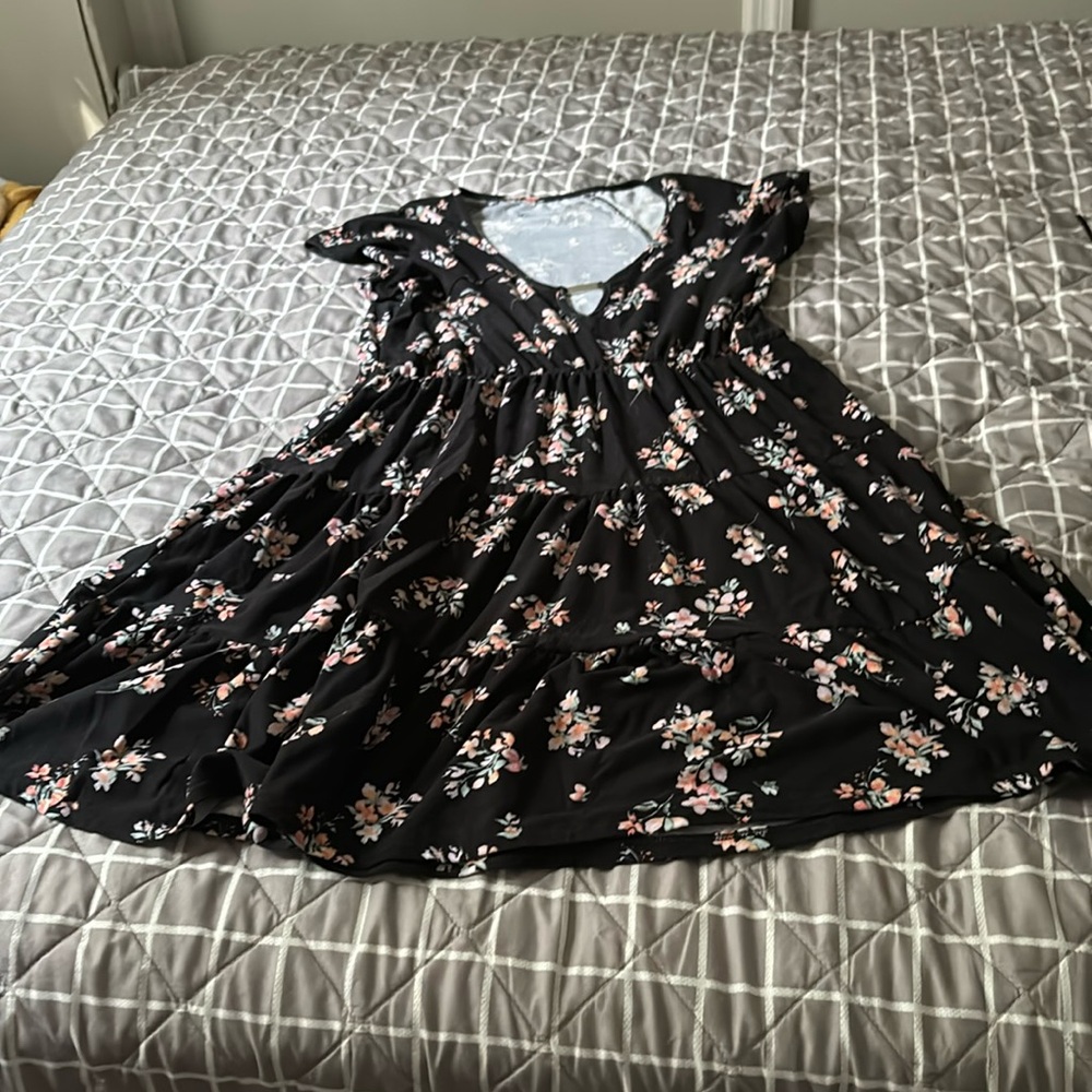 Casual dress with pink and teal flowers on it.